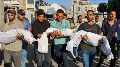 Trasladan cuerpos de tres niños muertos